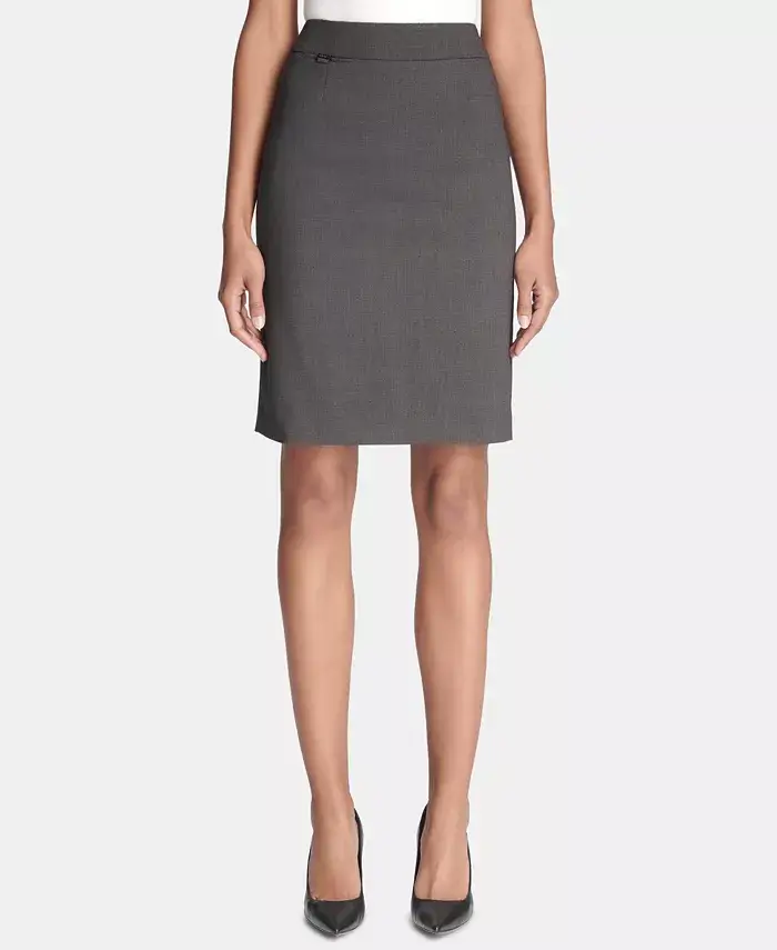 Professional woman wearing a classic gray mid-length pencil skirt paired with black high heels, showcasing a sleek and elegant office look.